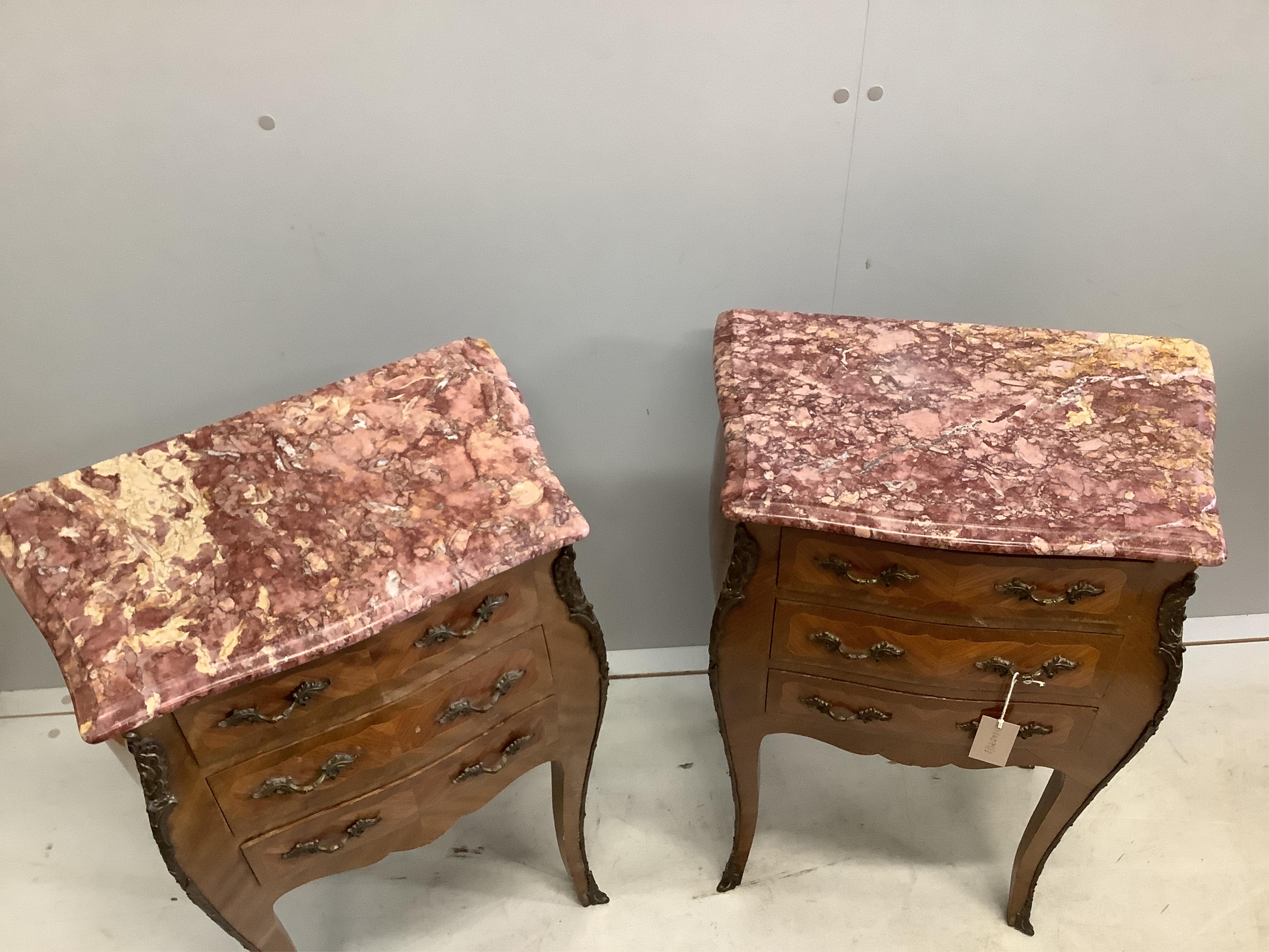 A pair of Louis XVI style kingwood marble top bombe bedside chests, width 48cm, depth 29cm, height 72cm. Condition - fair to good